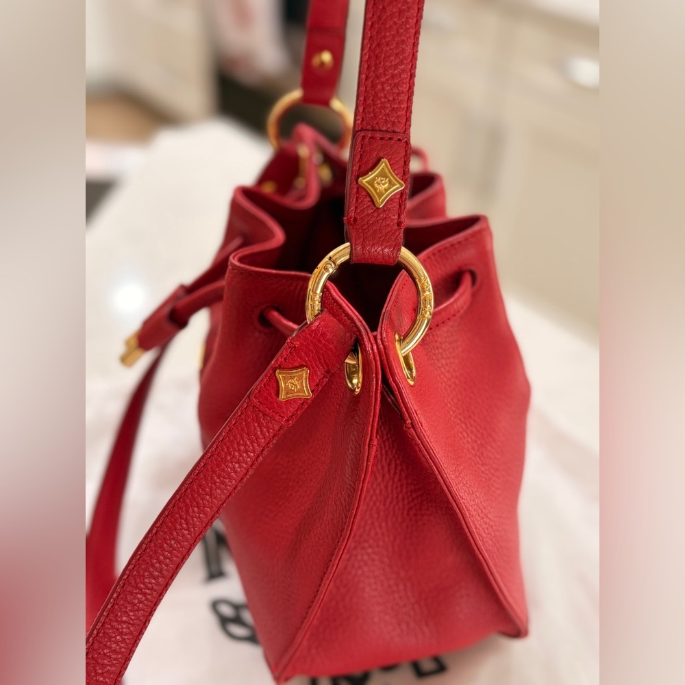 MCM Red Leather Bucket Bag
Crossbody Drawstring Gold Hardware - Picture 17 of 17